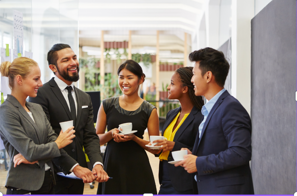group of young professionals talking with tea