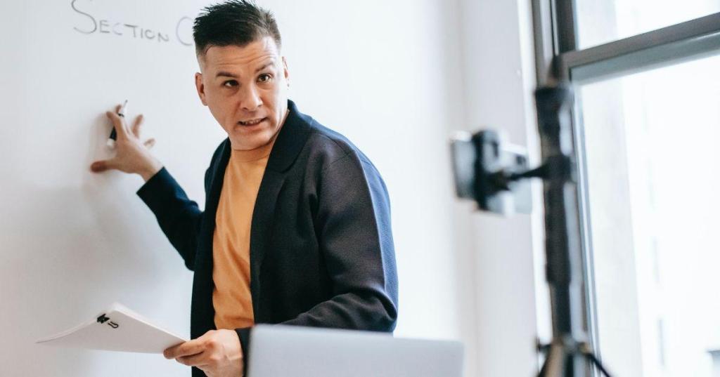 teacher pointing to white board