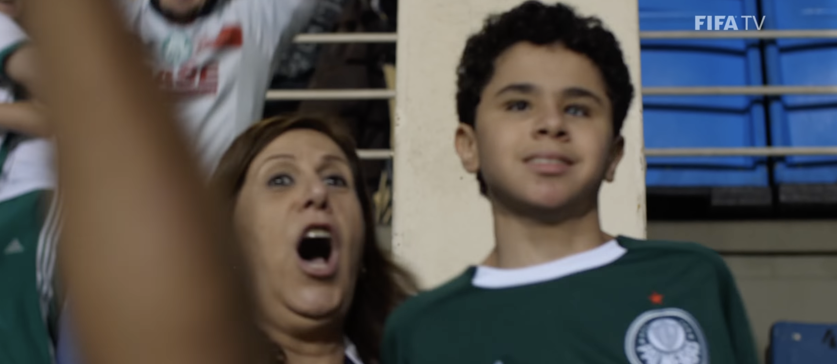 Silvia Grecco and her son Nikollas celebrating a soccer goal.