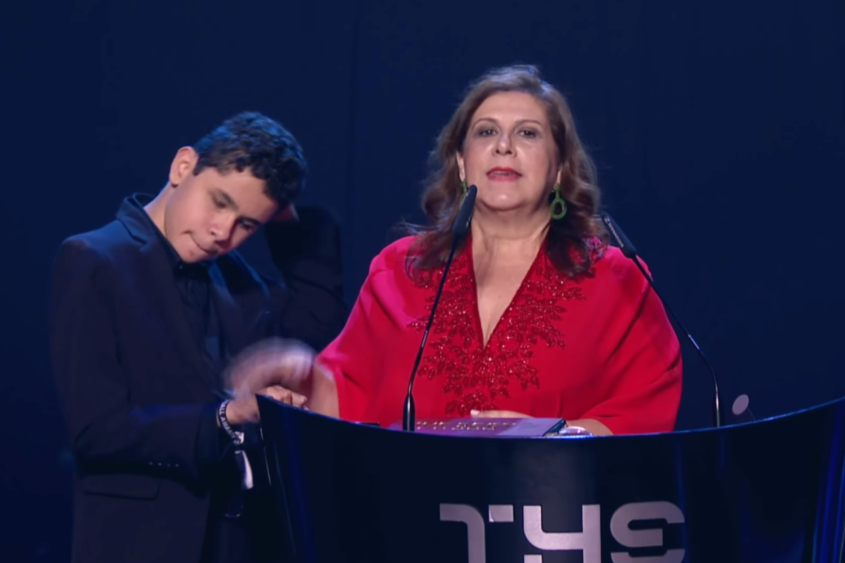 Silvia Grecco and her son Nikolass accepting FIFA's Best Fan Award in 2019
