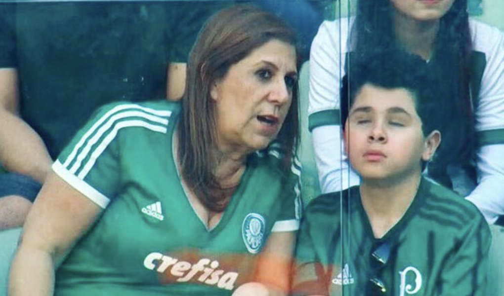 Silvia Grecco describing a soccer match to her blind son at the arena.