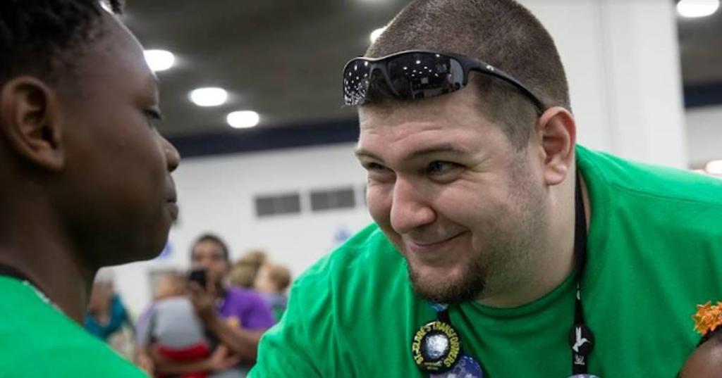 A teacher smiles at a student