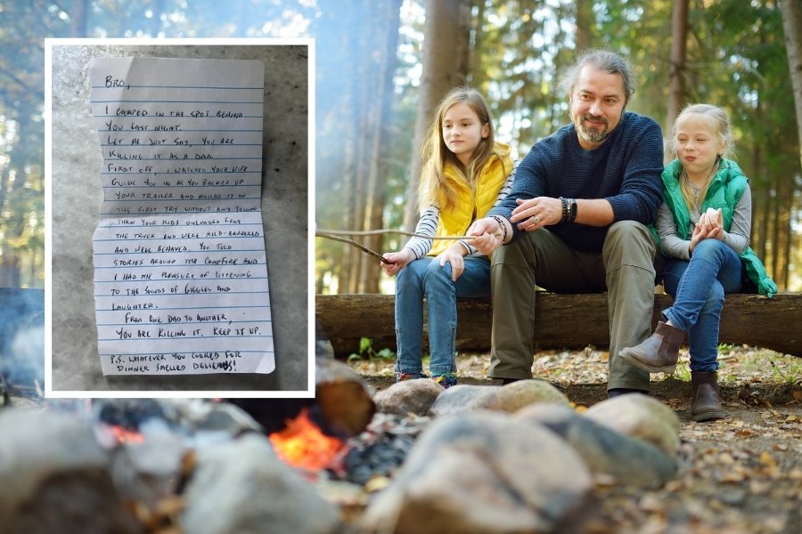 man sitting on log near campfire with two kids