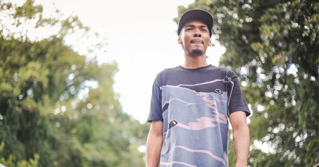 Black man walking outside