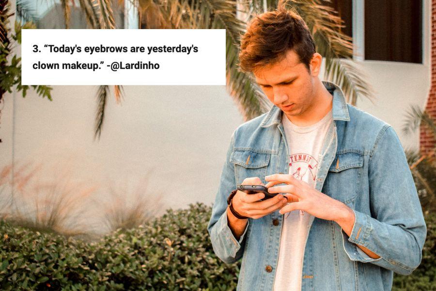 young man looking at his phone beside comment