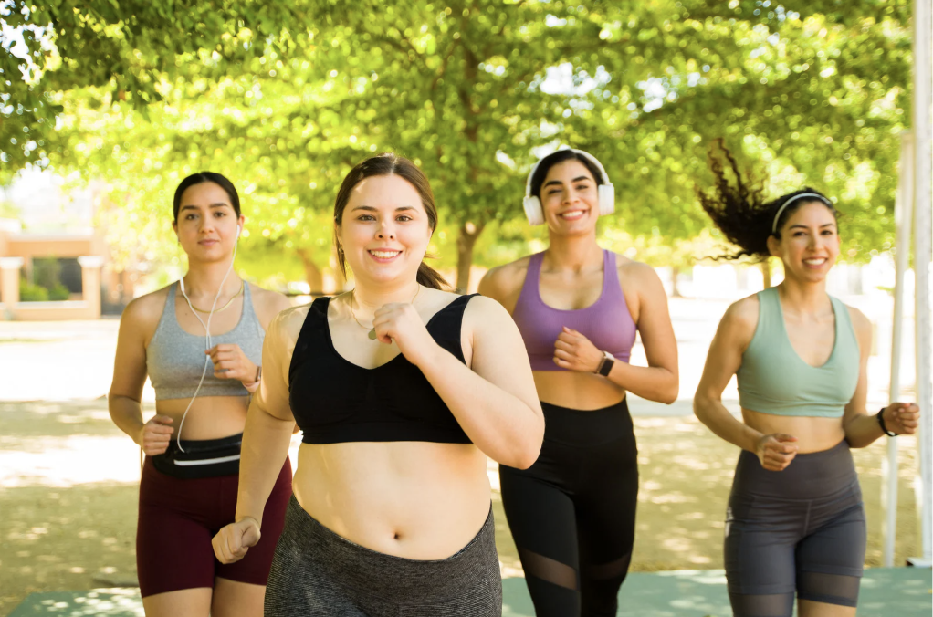A group of women jogging outside