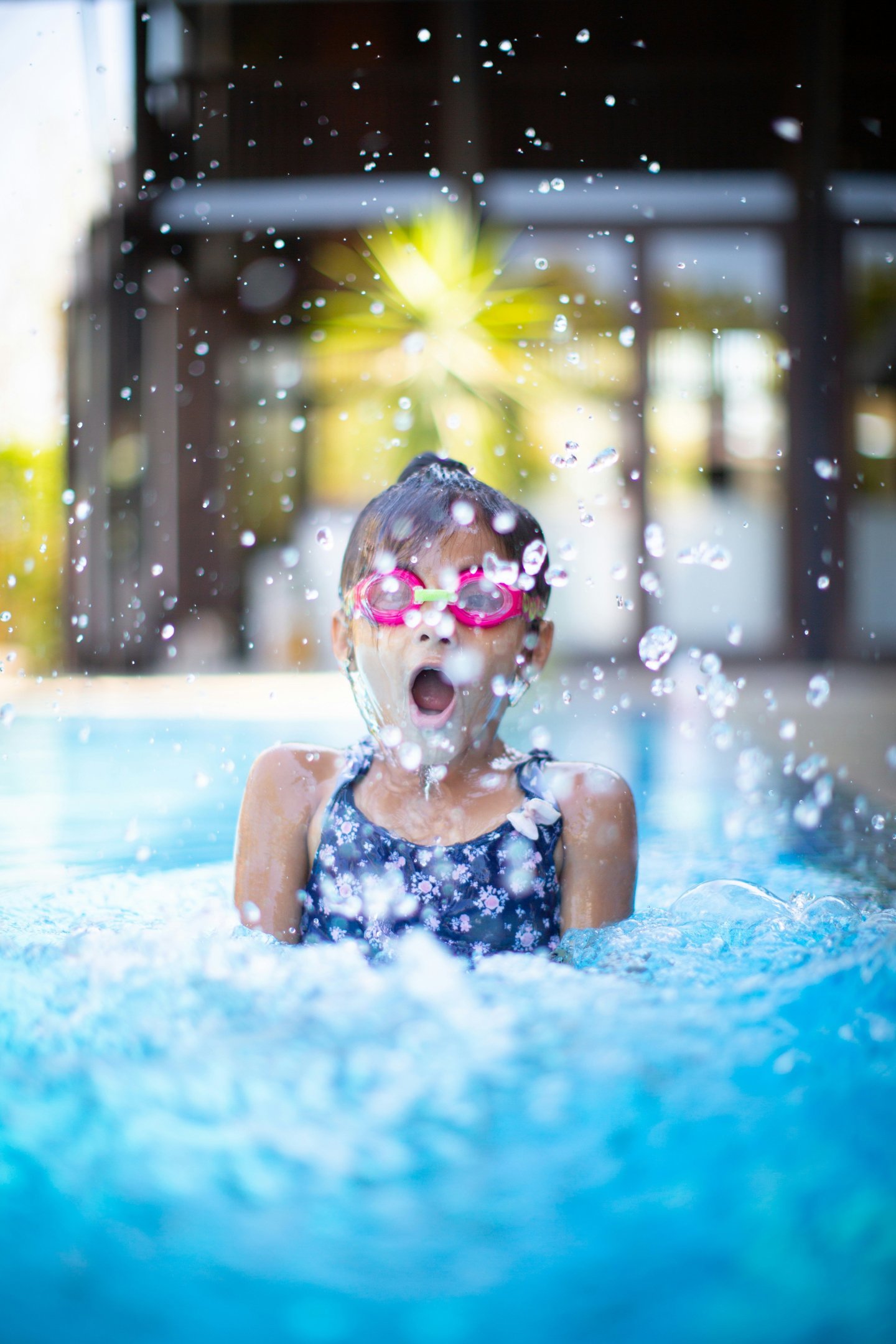 girl swims in swimming pool
