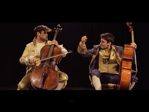 two cellists playing on stage