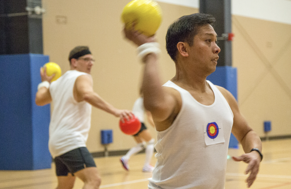 Men playing dodgeball