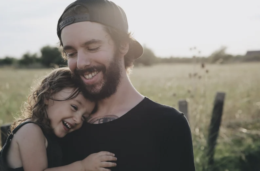 Dad hugging daughter