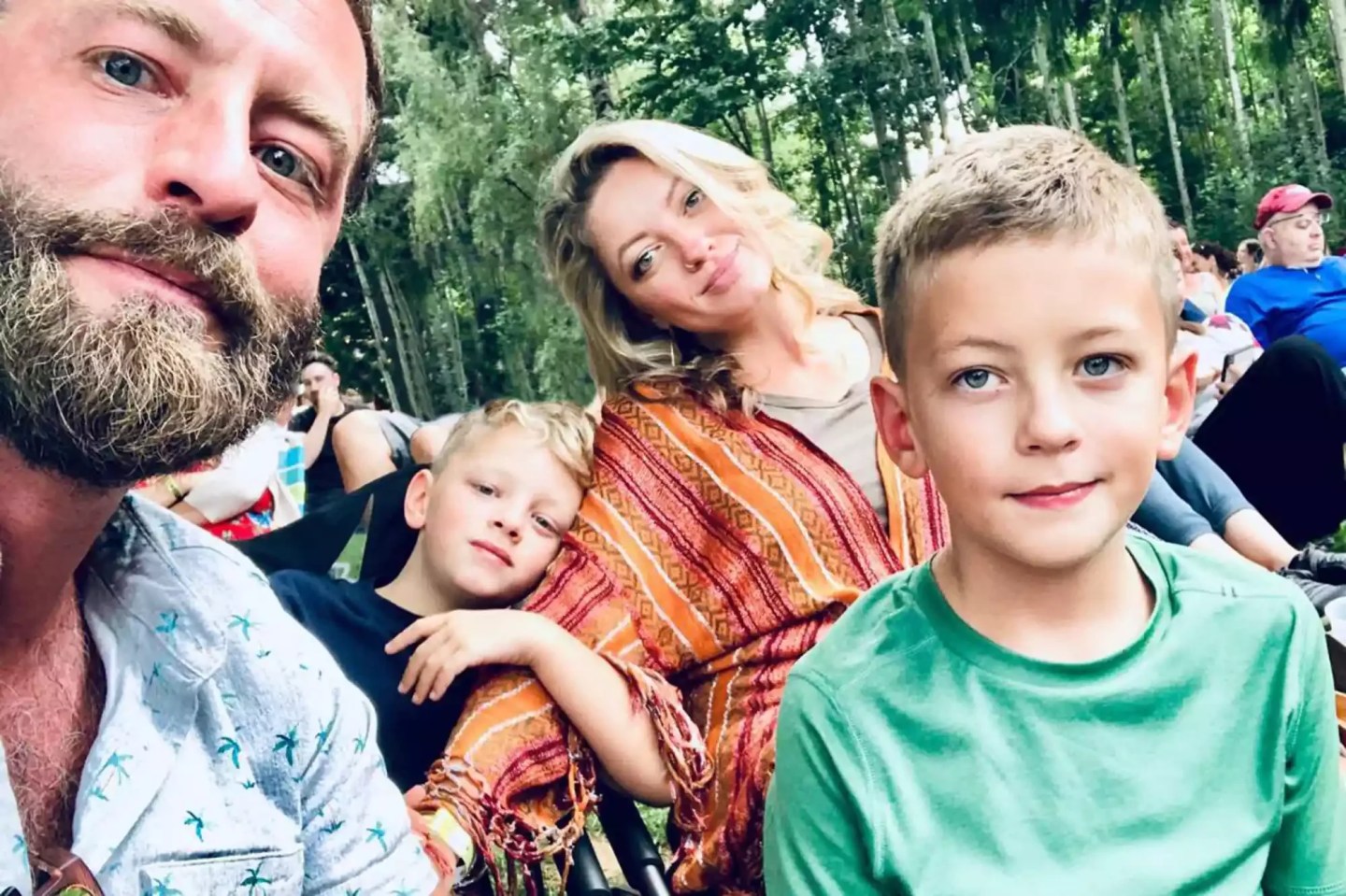 Young family takes a photo outside