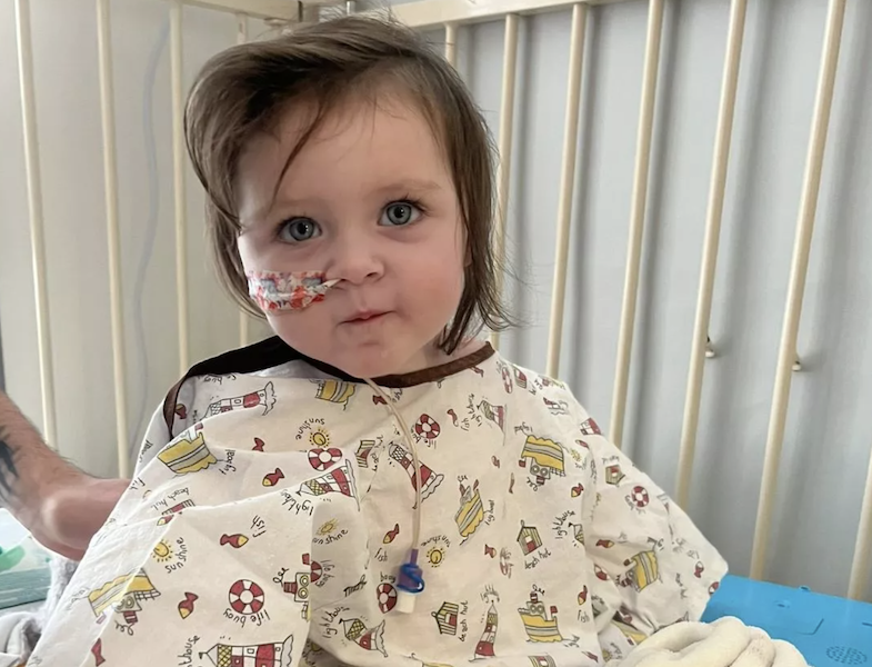 Toddler girl in a hospital bed