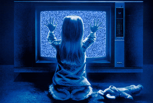 gif of Carol Anne placing her hands on the static TV screen from Poltergeist