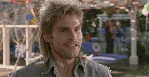 a man with a mullet fist pumping