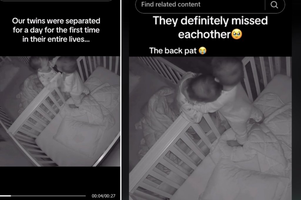twin babies hugging over the side of their cribs