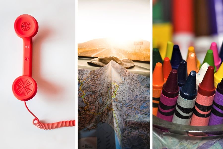 red wired telephone, map partially folded, crayons