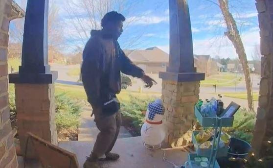 delivery man points to snacks left out for him on porch