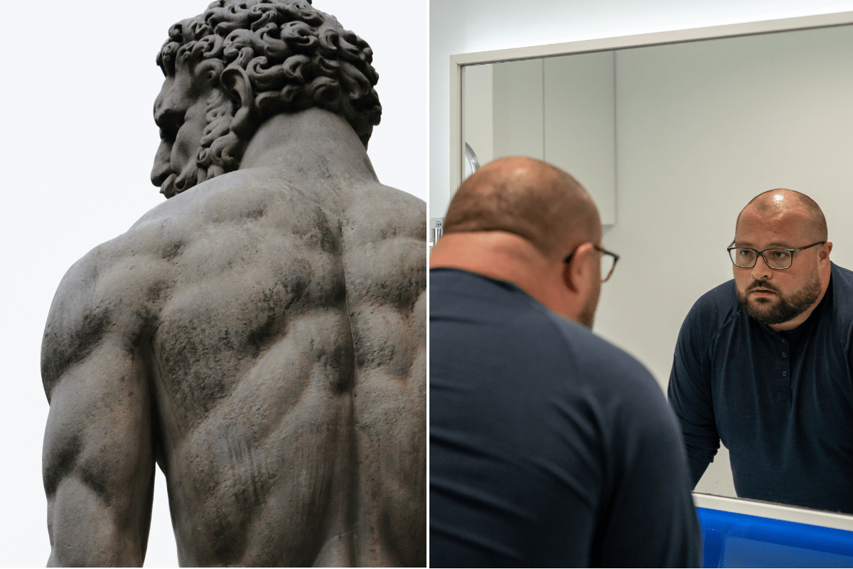 a possibly Greek statue of a man; a heavyset man looking in the mirror