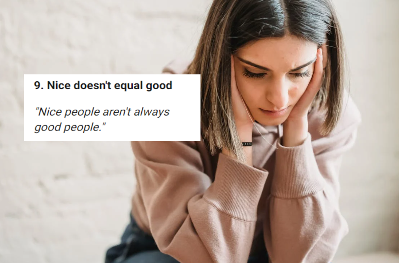 woman in brown sweater with her head in her hands looking troubled