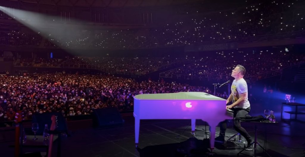 Marc Martel singing in a stadium of people