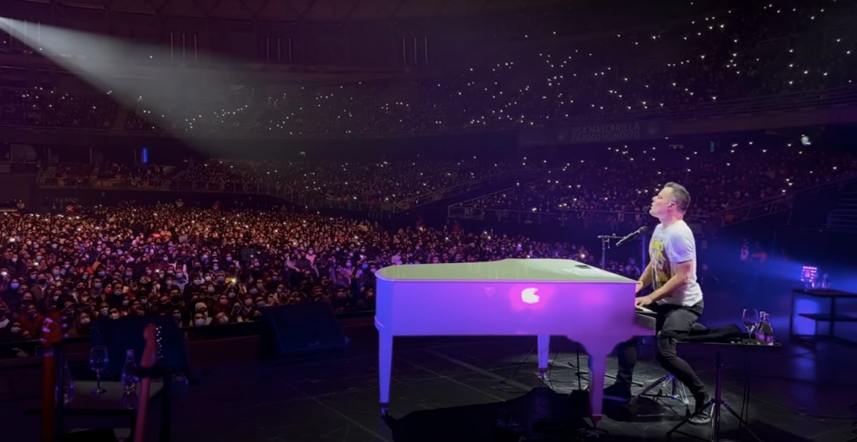 Marc Martel singing in a stadium of people
