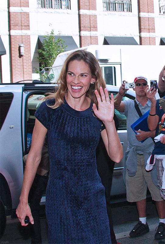 Actress Hilary Swank waving to fans