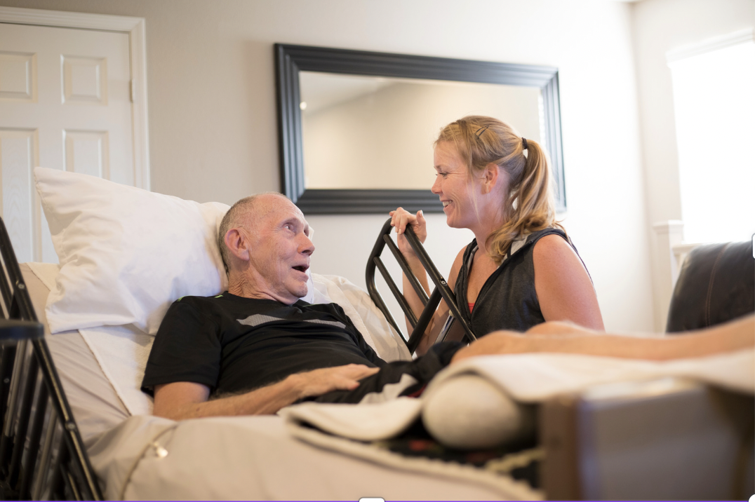 hospice nurse and patient talking to each other 