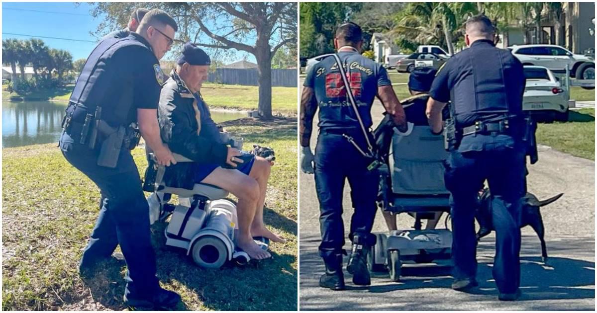man in a wheelchair attended by two professionals; a man in a wheelchair is walked down a road with two EMTs and a dog