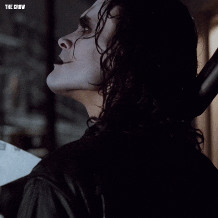 gif of a man in white and black goth makeup