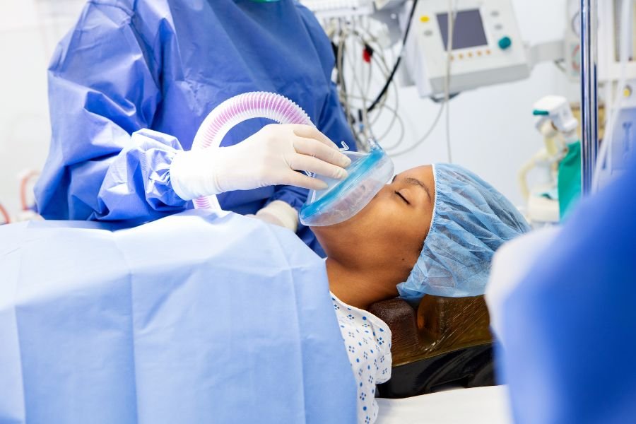 doctor providing anesthesia to a patient