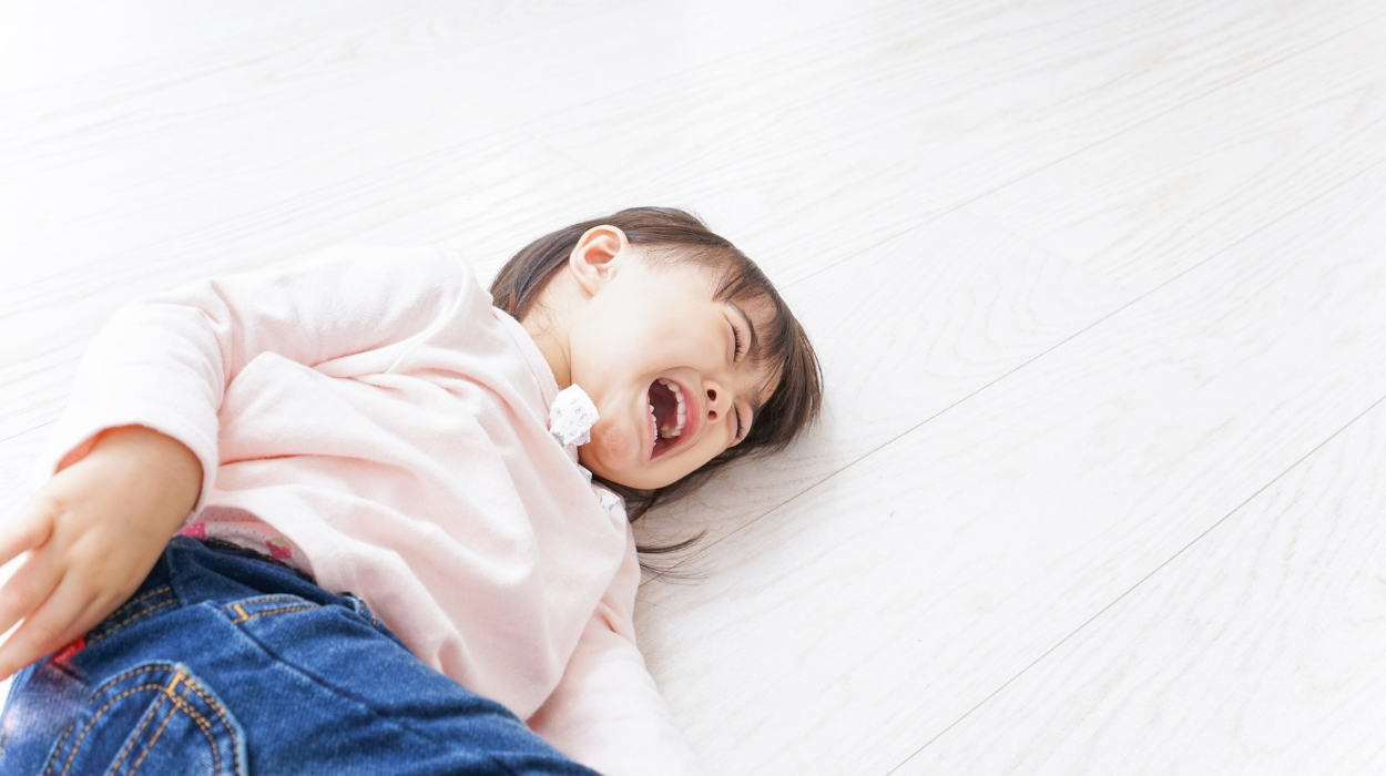 Child on floor crying