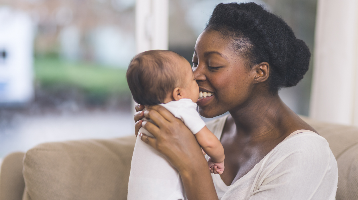 woman holding newborn baby