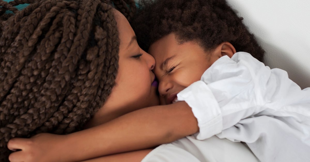 mom with toddler sleeping