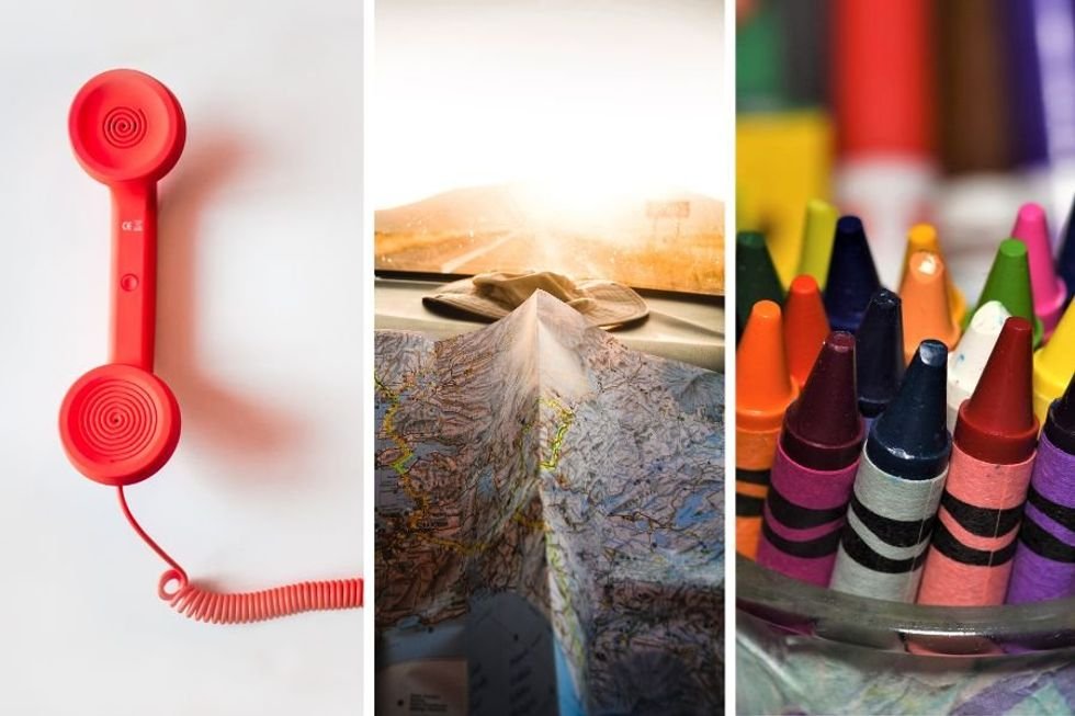 red wired telephone, map partially folded, crayons