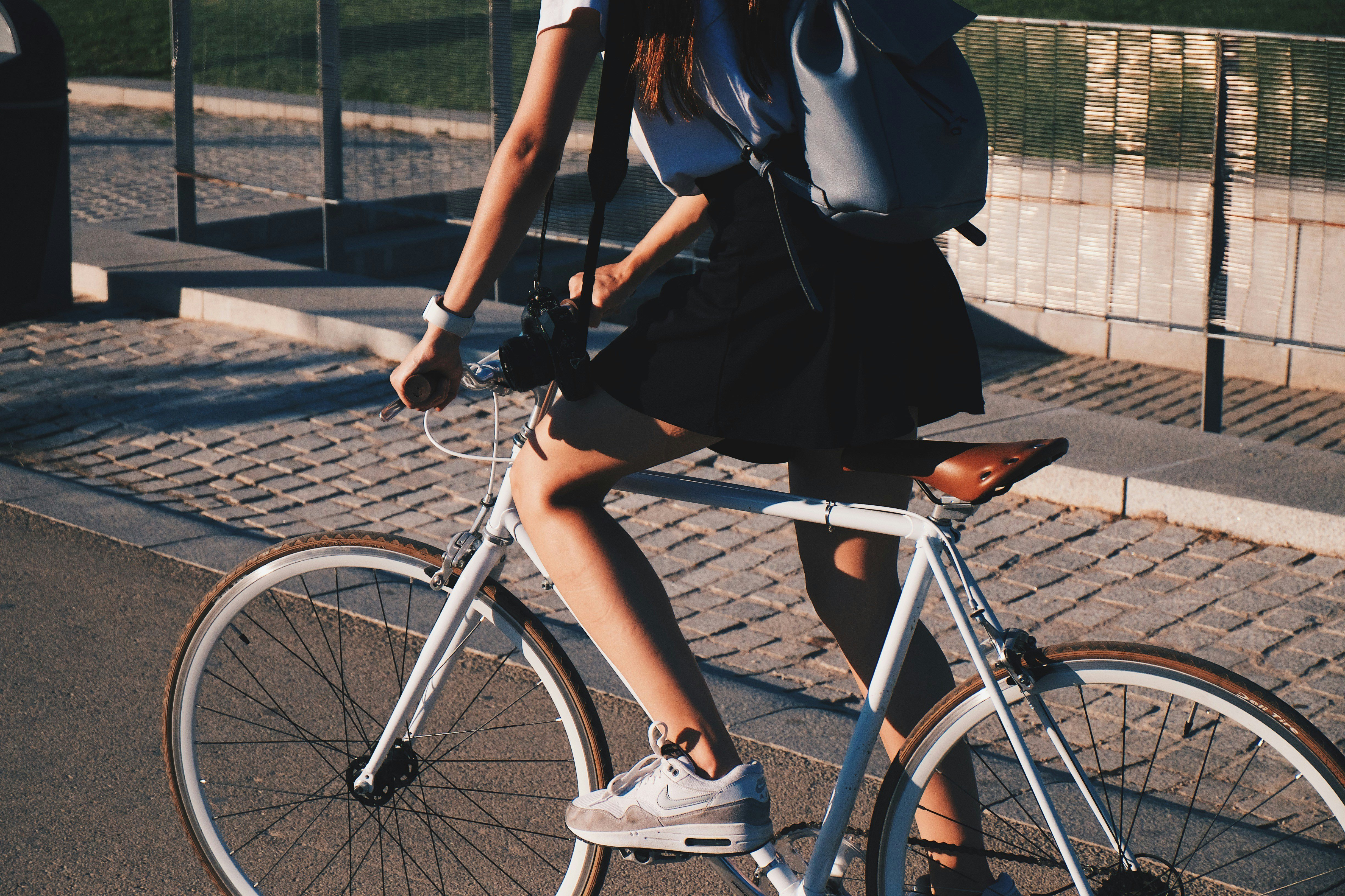 woman riding white bike