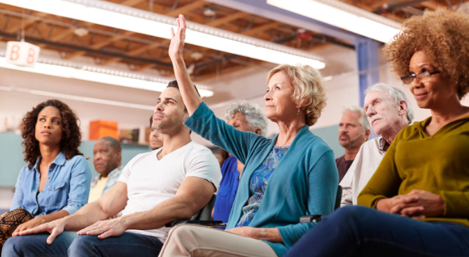 woman raising hand, seminar, class, purpose, question