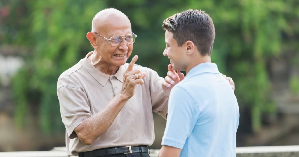 old man talking to young man