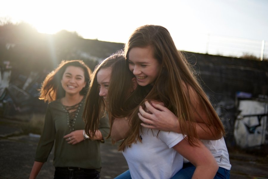teens, hanging out, friends, playing outside, face to face