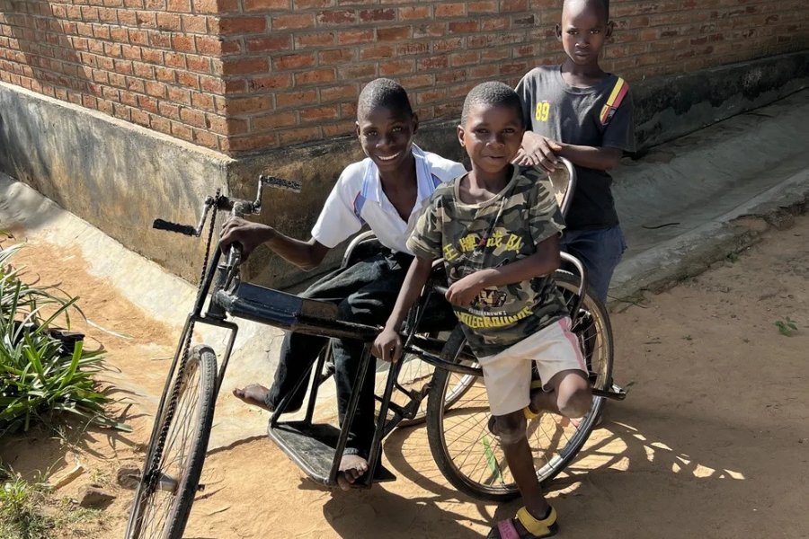 Boy carried two miles to school inspires a locally-made wheelchair mission in Malawi
