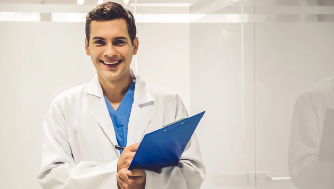 doctor, young doctor, millennial doctor, doctor with clipboard, smiling doctor, 