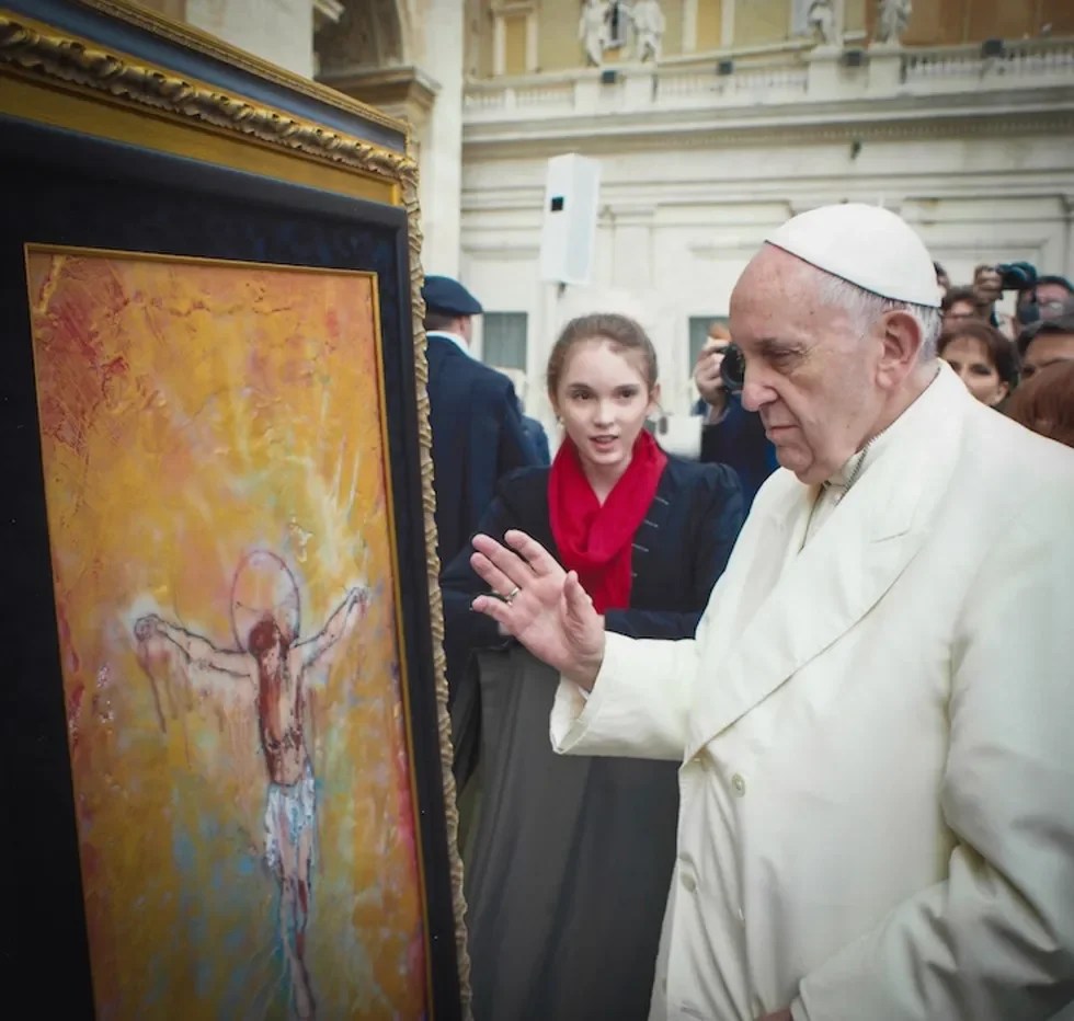 Pope Francis looking at painting