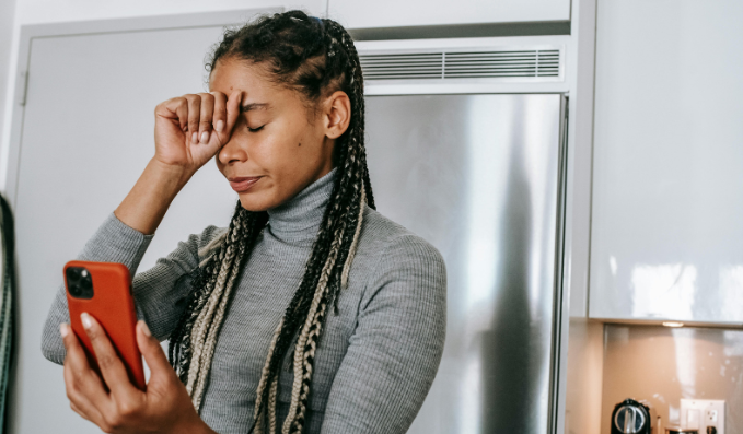 woman, dispair, smartphone, bad news, woman in kitchen, upset woman