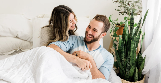 happy coupe, couple in bed, young married couple, man with beard, smiling woman