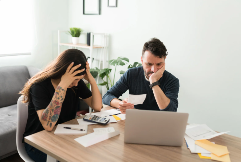Real people share 15 practical things they did to escape living paycheck to paycheck