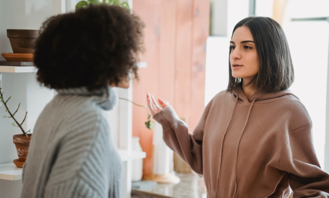 woman arguing, woman fighting, women in kitchen, conflict, two women, woman confused,