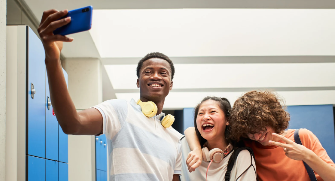 teens with phones, kids and phones, anxiety, smeartphone addiction, dopamine, phones schools