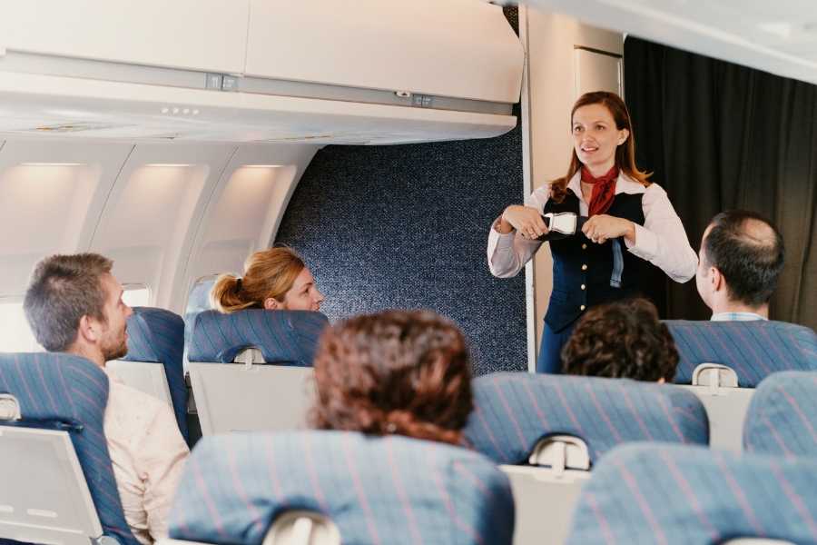 flight attendant, safety presentation, airplane safety, seatbelts, courtesy