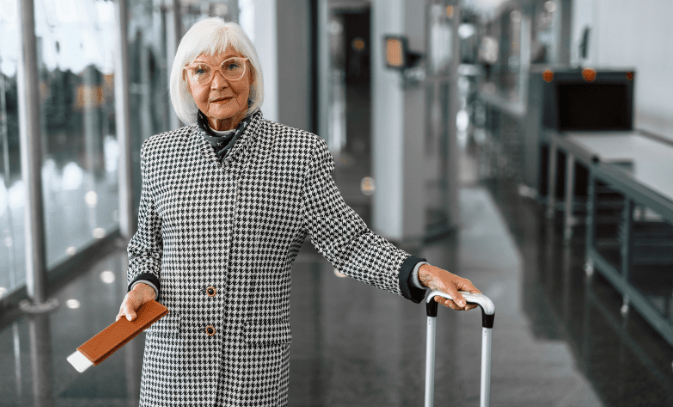 baby boomers, grandparents, travel, airport, senior woman traveling, luggage