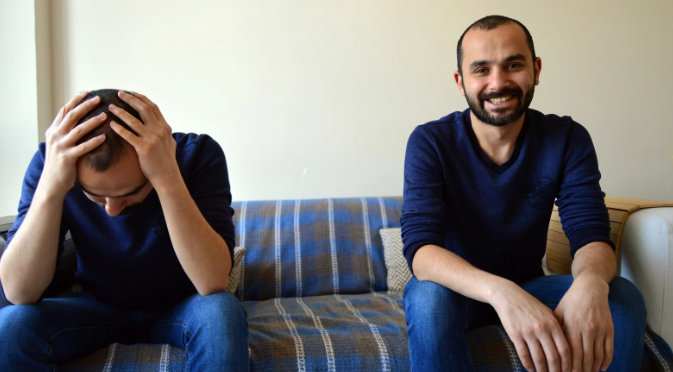 positive and negative, happy and sad, man on couch, optimism pessimism,