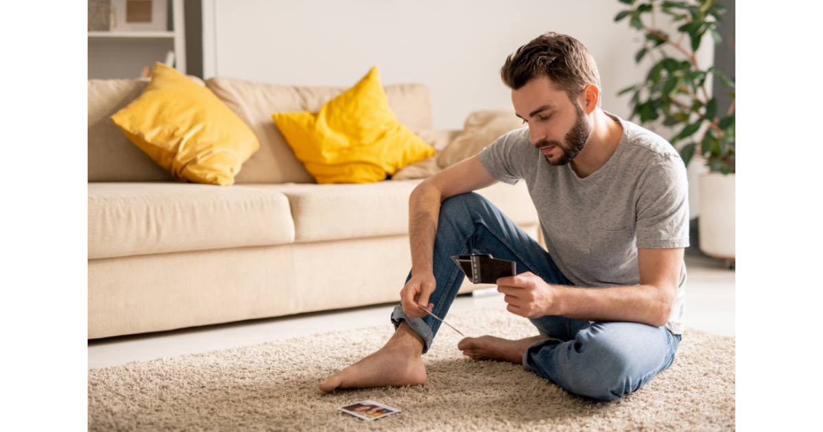 man, old photos, photographs, looking through photos, memories